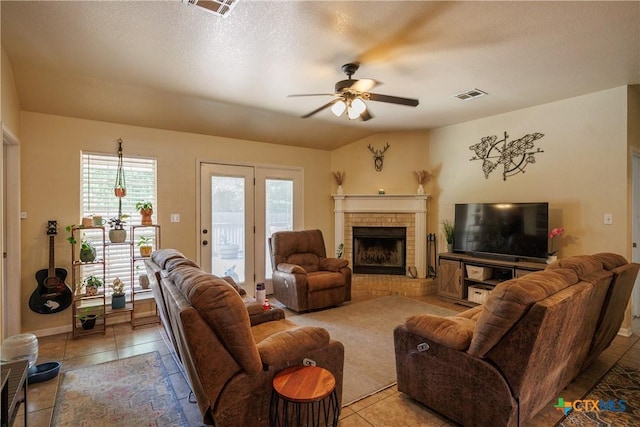 6 S Bobcat Ct, Belton, TX 76513 - living room featuring a ceiling fan, light tile patterned floors, and a brick fireplace