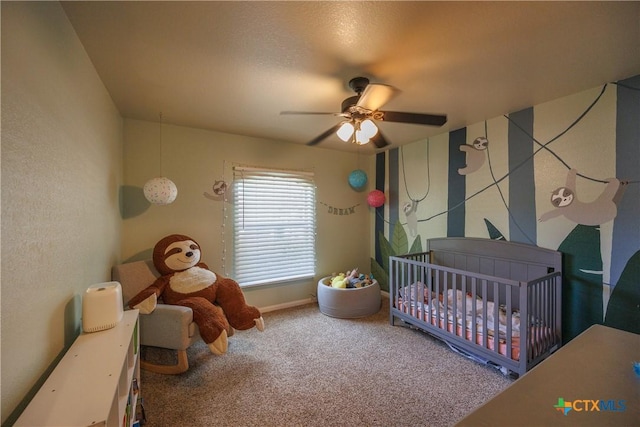 6 S Bobcat Ct, Belton, TX 76513 - carpeted bedroom featuring a crib and ceiling fan