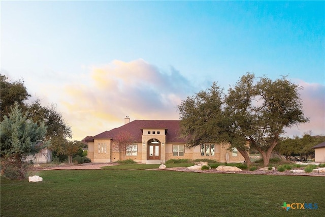 226 Sabella, Spring Branch, TX 78070 - view of front facade featuring a front yard, french doors, stucco siding, and a chimney