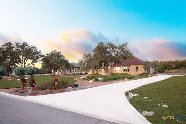 226 Sabella, Spring Branch, TX 78070 - view of front of home with curved driveway and a front lawn