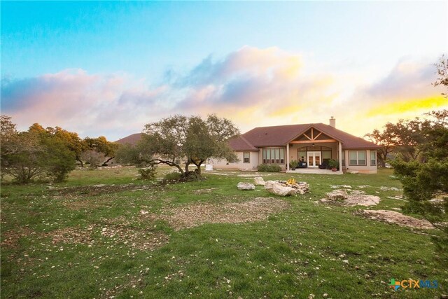 226 Sabella, Spring Branch, TX 78070 - back of property at dusk featuring a yard and a chimney