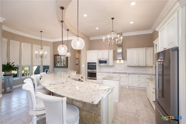 226 Sabella, Spring Branch, TX 78070 - kitchen with appliances with stainless steel finishes, a chandelier, a sink, a large island with sink, and tasteful backsplash