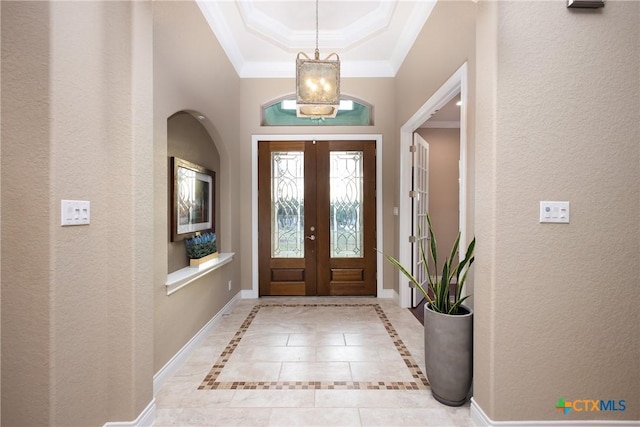 226 Sabella, Spring Branch, TX 78070 - entryway with a textured wall, a chandelier, a raised ceiling, ornamental molding, and baseboards