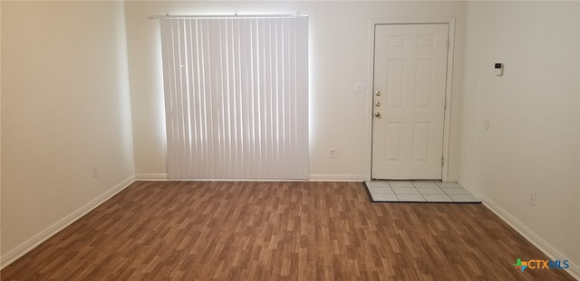 spare room with hardwood / wood-style floors