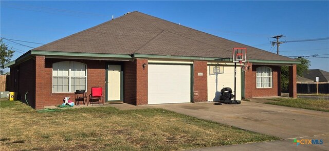 3801 Hitchrock Dr, Killeen, TX 76549 - view of front facade featuring brick siding, a garage, concrete driveway, and a front yard