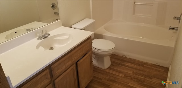 full bathroom with toilet, vanity, hardwood / wood-style floors, and  shower combination