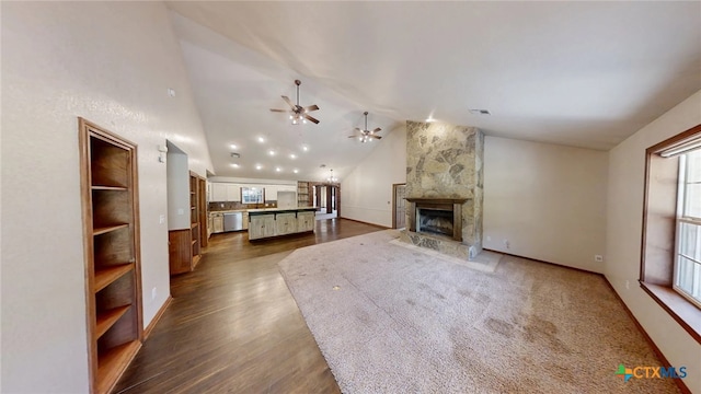 1260 Great Oaks Dr, Salado, TX 76571 - unfurnished living room featuring a ceiling fan, vaulted ceiling, a fireplace, and dark wood-type flooring