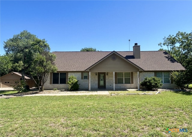 1260 Great Oaks Dr, Salado, TX 76571 - ranch-style home with a front yard, a chimney, a shingled roof, and stone siding