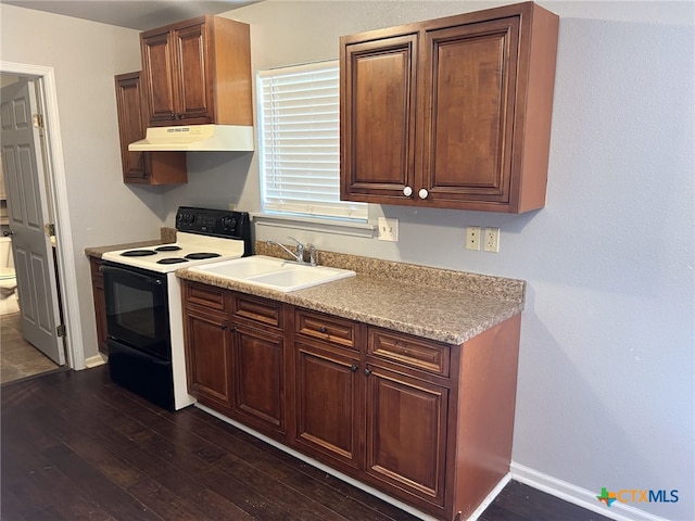 1260 Great Oaks Dr, Salado, TX 76571 - kitchen featuring black range with electric stovetop, under cabinet range hood, dark wood-type flooring, and light countertops