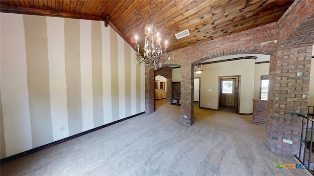 1260 Great Oaks Dr, Salado, TX 76571 - unfurnished living room featuring arched walkways, wood ceiling, carpet, a chandelier, and vaulted ceiling