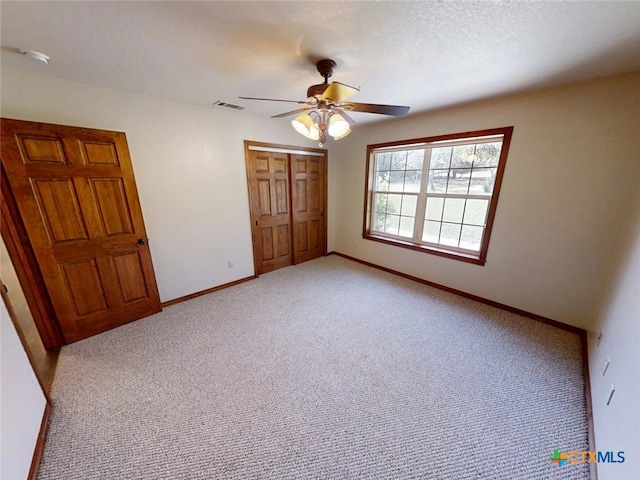 1260 Great Oaks Dr, Salado, TX 76571 - unfurnished bedroom featuring a closet, carpet floors, and ceiling fan