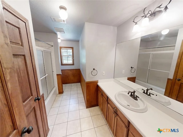 1260 Great Oaks Dr, Salado, TX 76571 - full bathroom featuring tile patterned flooring, a wainscoted wall, vanity, combined bath / shower with glass door, and wooden walls