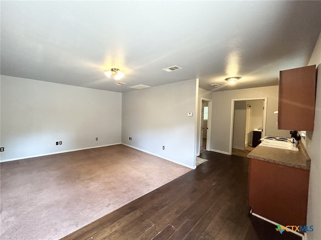 1260 Great Oaks Dr, Salado, TX 76571 - unfurnished living room with baseboards and dark wood-type flooring