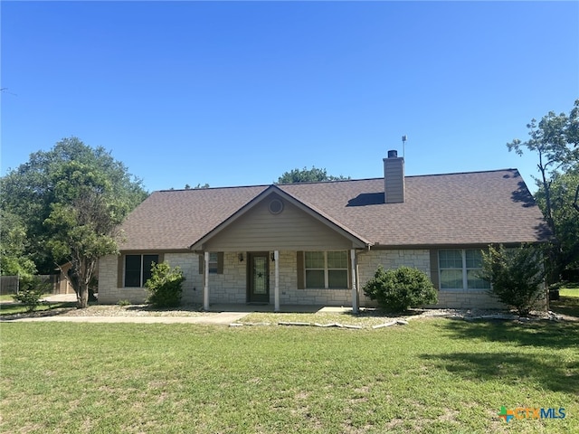 1260 Great Oaks Dr, Salado, TX 76571 - ranch-style house featuring a front lawn, a chimney, roof with shingles, and stone siding