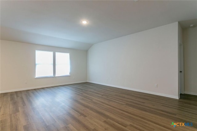 1003 Antelope Trl, Temple, TX 76504 - unfurnished room with recessed lighting, vaulted ceiling, baseboards, and dark wood-style floors