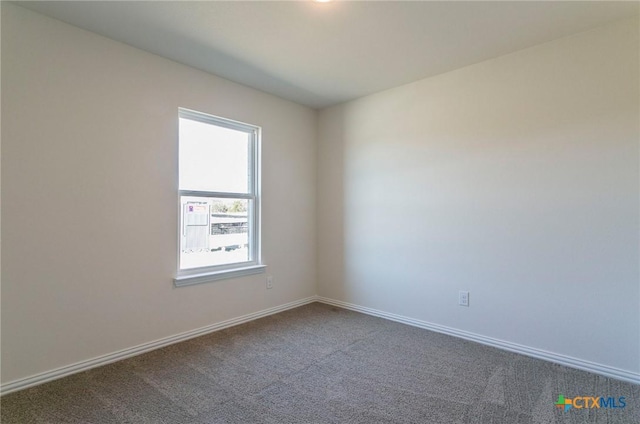 1003 Antelope Trl, Temple, TX 76504 - unfurnished room with dark colored carpet and baseboards