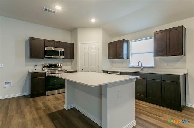 1003 Antelope Trl, Temple, TX 76504 - kitchen with a sink, dark brown cabinetry, light countertops, appliances with stainless steel finishes, and visible vents