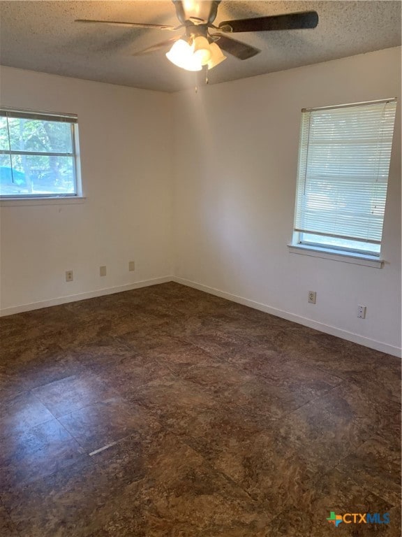 unfurnished room featuring a textured ceiling and ceiling fan