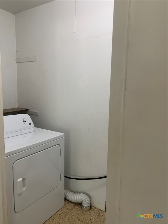 laundry room with washer / dryer