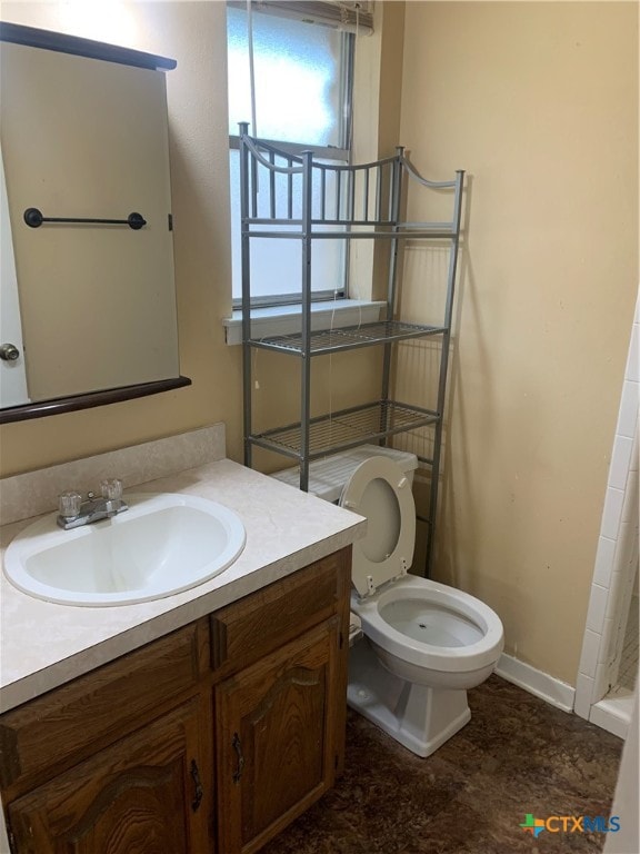 bathroom with vanity and toilet