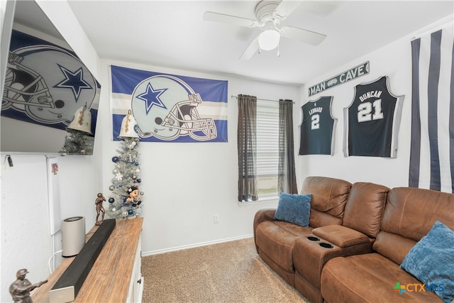 carpeted living room with ceiling fan