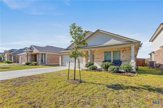 view of front of property featuring a front yard, a garage, and cooling unit