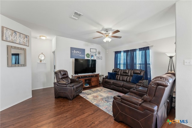 living room featuring ceiling fan and dark hardwood / wood-style flooring