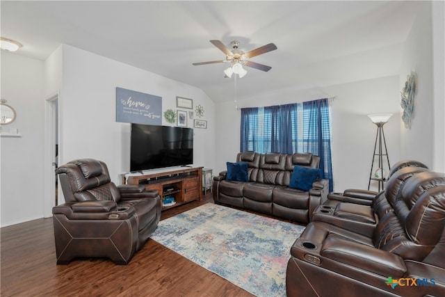 living room featuring vaulted ceiling, ceiling fan, and dark hardwood / wood-style floors