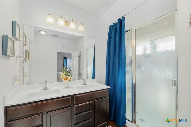 bathroom featuring vanity and walk in shower