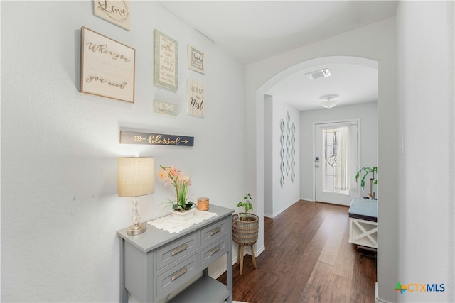 hallway featuring dark hardwood / wood-style flooring