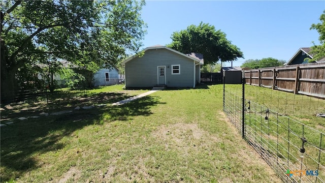 1804 N Goldman St, Victoria, TX 77901 - fenced backyard featuring a storage shed