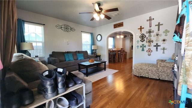 1804 N Goldman St, Victoria, TX 77901 - living area featuring arched walkways, ceiling fan, wood finished floors, and healthy amount of natural light