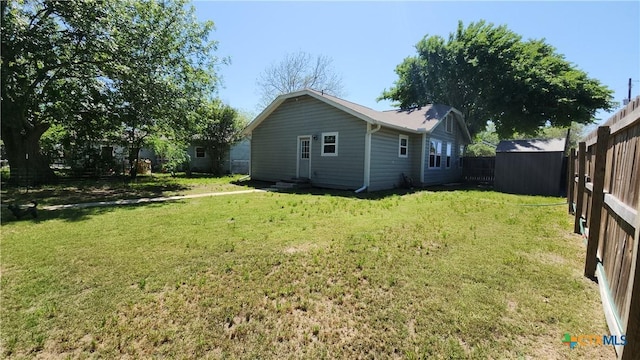 1804 N Goldman St, Victoria, TX 77901 - fenced backyard featuring a shed