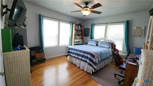 1804 N Goldman St, Victoria, TX 77901 - bedroom with light wood-style floors and ceiling fan
