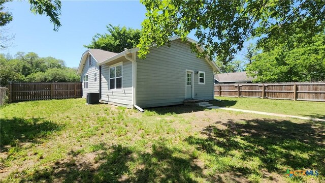 1804 N Goldman St, Victoria, TX 77901 - rear view of house with a fenced backyard and entry steps