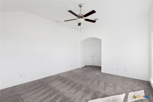 empty room with carpet, vaulted ceiling, and ceiling fan