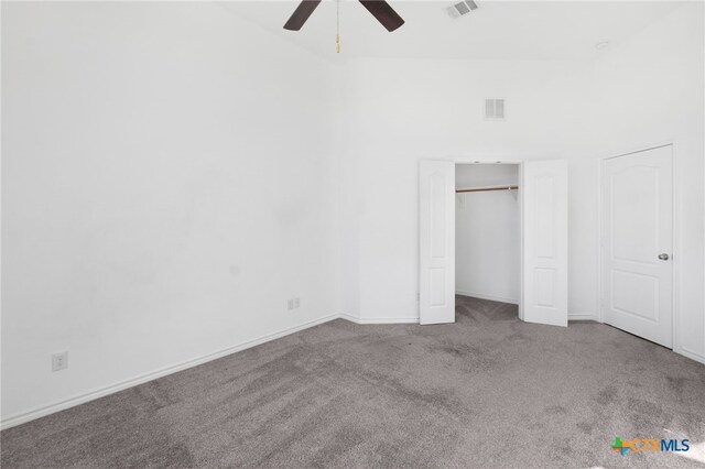 unfurnished bedroom featuring light colored carpet and ceiling fan