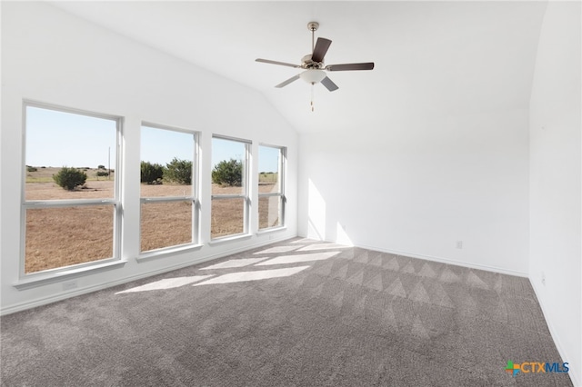 carpeted spare room with lofted ceiling and ceiling fan