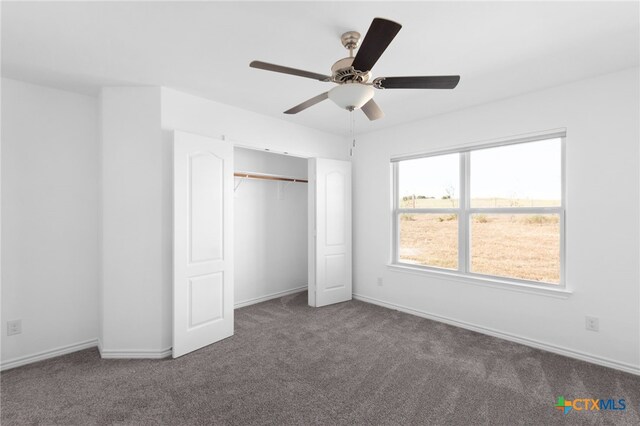 unfurnished bedroom featuring a closet, carpet, and ceiling fan