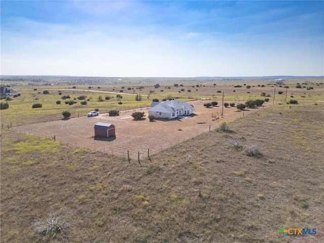 birds eye view of property featuring a rural view