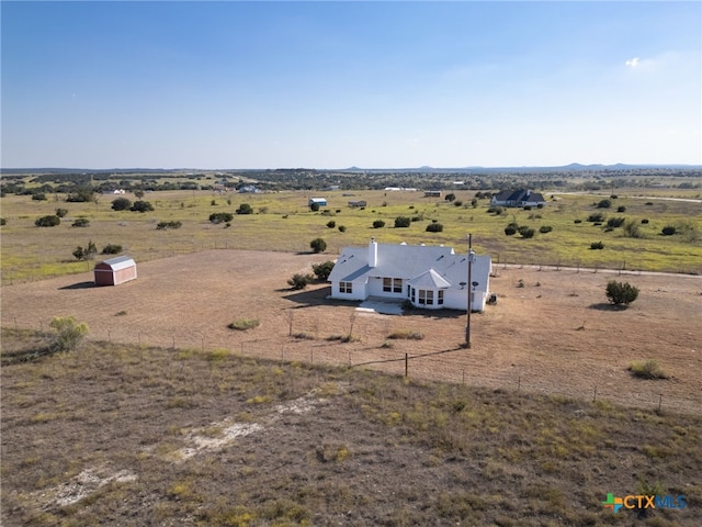 birds eye view of property featuring a rural view