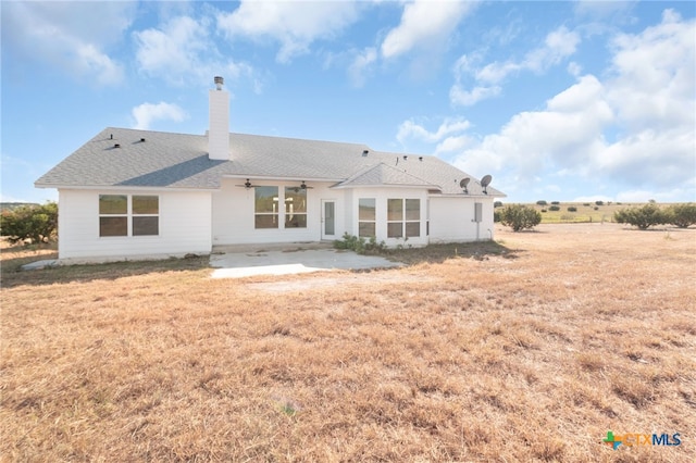 rear view of property featuring a patio