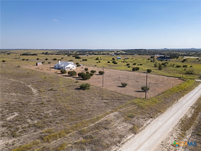 birds eye view of property featuring a rural view