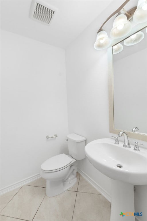 bathroom featuring tile patterned floors and toilet