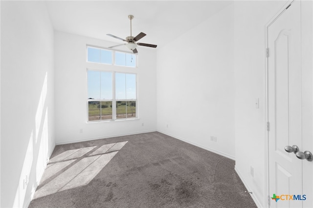 empty room featuring carpet and ceiling fan