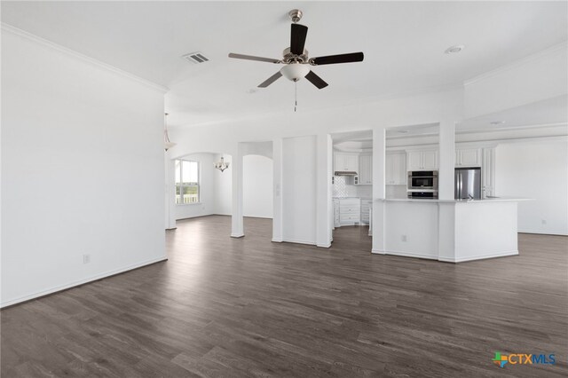 unfurnished living room with ceiling fan, dark hardwood / wood-style floors, and crown molding