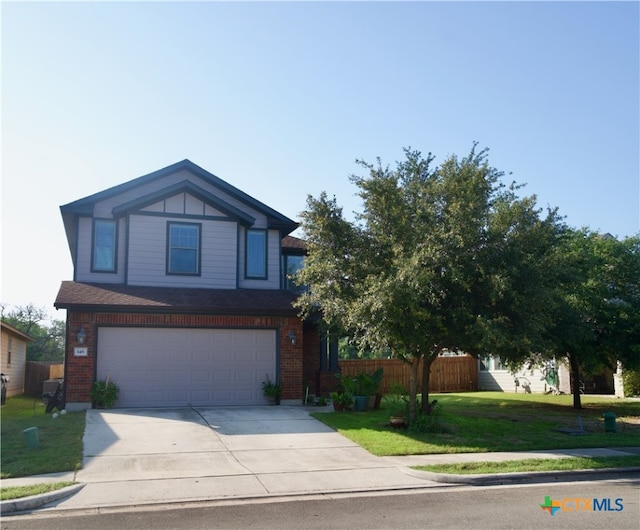 view of front of home with a garage and a front lawn