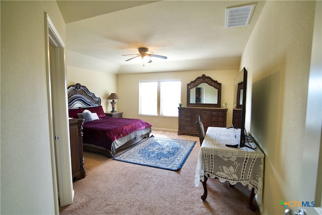 bedroom featuring ceiling fan and light carpet