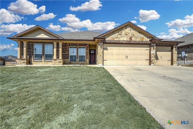 ranch-style home featuring a front lawn and a garage