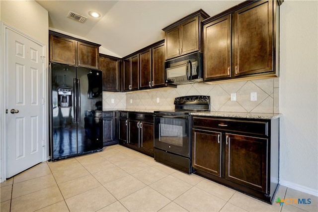 kitchen with black appliances, backsplash, dark brown cabinetry, light stone countertops, and lofted ceiling